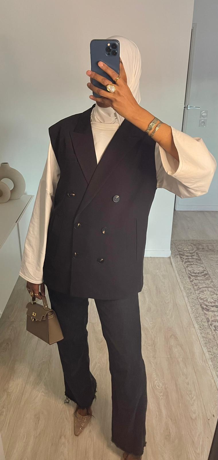 Blazer noir sans manches, boutonnage simple