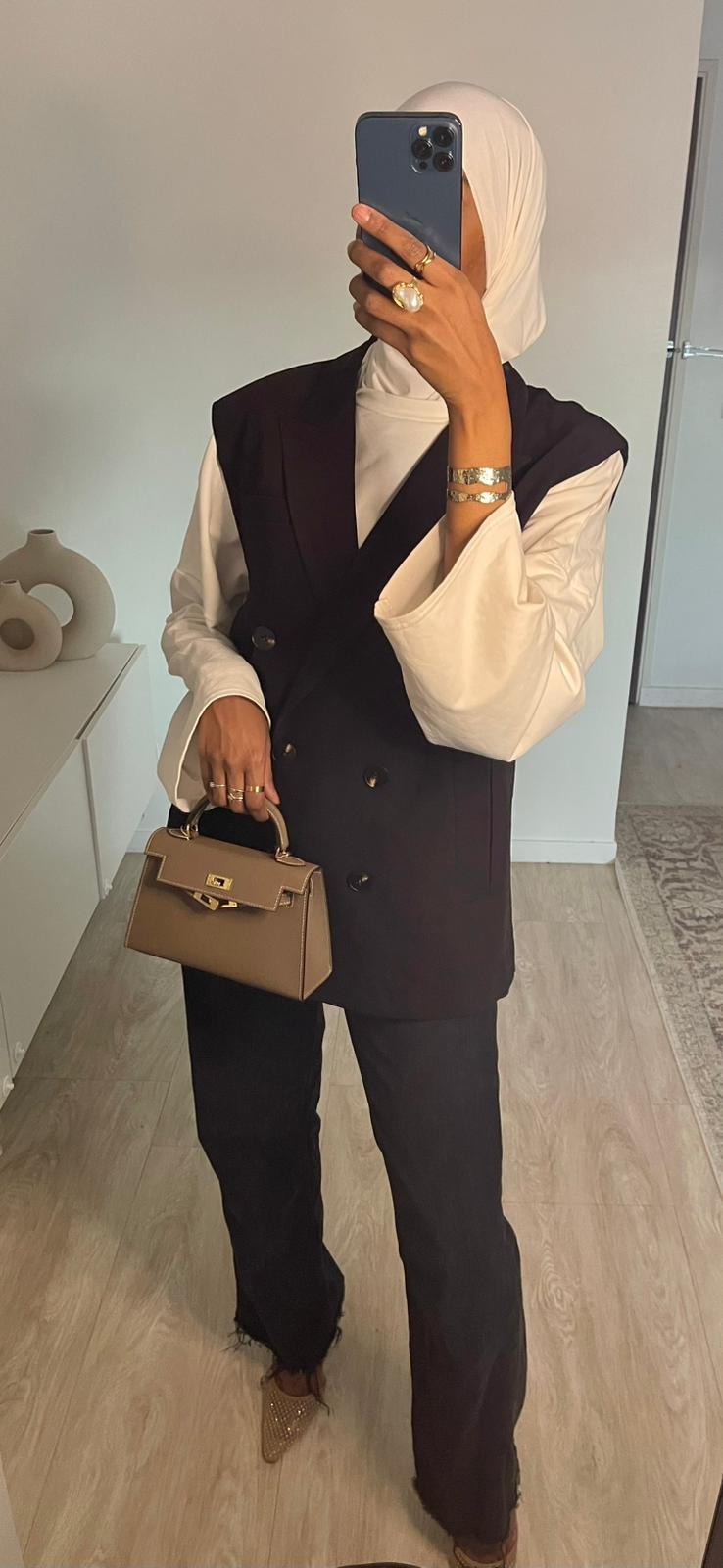 Blazer noir sans manches, boutonnage simple